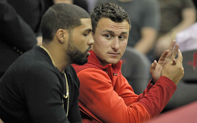 Hello, Houston -- Johnny Manziel got to hang out with Arian Foster at a recent Rockets game. (USATSI)