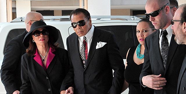 Muhammad Ali, with his wife Lonnie (left), attends the funeral of former trainer Angelo Dundee. (AP)