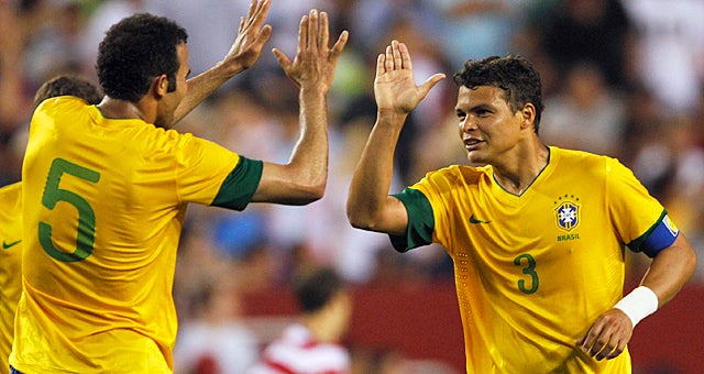 Thiago Silva (right) notches a goal as Brazil improves to 16-1 against the United States. (Getty Images)