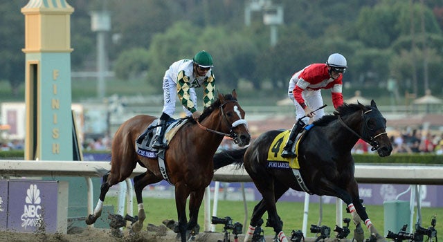 Fort Larned, a 9-1 longshot, beats Mucho Macho Man to take the $5 million Classic. (Getty Images)
