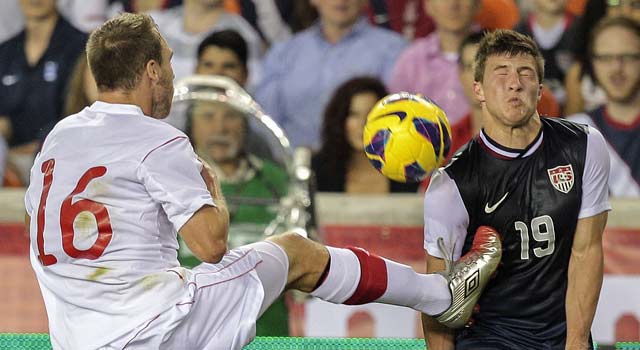 The USA's Joshua Gatt gets a kick to the chest during the men's listless 0-0 draw against Canada. (Getty Images)