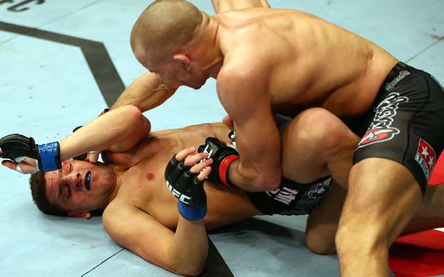 Georges St-Pierre (24-2) wins 50-45 on all three cards to beat Nick Diaz. (Getty Images)