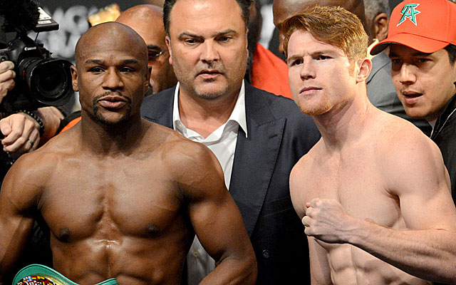 Floyd Mayweather and Canelo Alvarez at Friday's weigh-in. (USATSI)