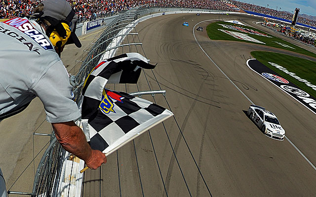 Brad Keselowski passes Dale Earnhardt Jr. on the final lap to win his first race of the season. (Getty Images)
