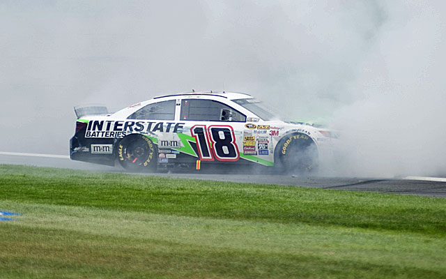 Kyle Busch smokes the tires after winning at Auto Club Speedway. (USATSI)