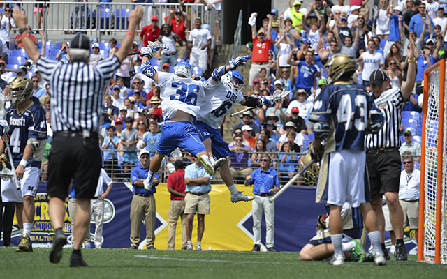 Duke's Kyle Keenan celebrates with Jack Bruckner (left) after scoring in the fourth quarter. (USATSI)