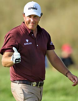 Phil Mickelson doesn't exactly give it a thumbs up, but the 'award' certainly beats the alternative. (Getty Images)
