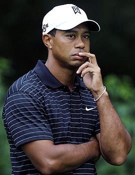 The timing of Tiger Woods' divorce and his ex-wife's interview don't make it easier for the No. 1 golfer at the FedEx opener. (AP)