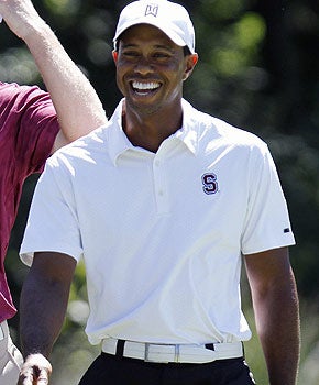 Tiger Woods has reason to smile on this day as he matches his best score of the year. (AP)