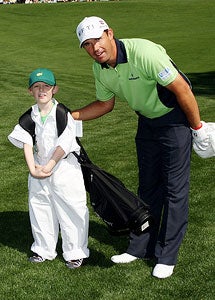 Padraig Harrington (right) and his son, Patrick, take part in the annual par-3 contest at Augusta. (Getty Images)