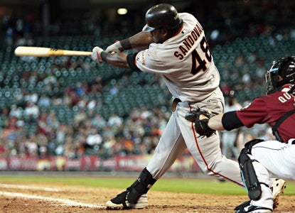 Pablo Sandoval swings through a tie-breaking, two-run shot in the 11th to give the Giants a much-needed victory.   (AP)