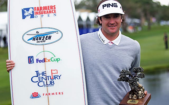 Bubba Watson cradles his winner's surfboard and trophy last January 30 at Torrey Pines. (US Presswire)