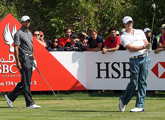 Rory McIlroy (right) rebounds with a 68 in Round 3 as Woods sprints past into the lead. (Getty Images)