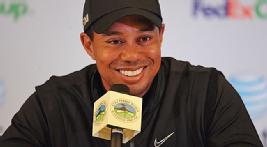 Woods is all smiles after six birdies and a bogey put him in contention heading into Sunday. 