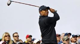Tiger Woods makes a big charge on moving day, carding six birdies in an eight-hole stretch.