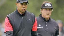 Tiger Woods begins the day ahead of Phil Mickelson, but Lefty charges to the front.