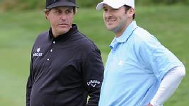 Mickelson stops for a chat with Tony Romo, Tiger's pro-am playing partner.