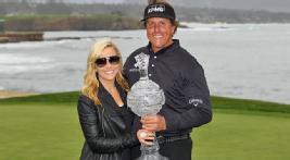 Amy Mickelson shares the trophy moment with her husband at Pebble Beach. 