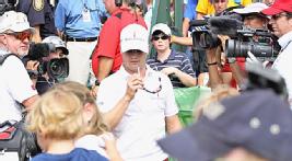 Zach Johnson gets the bad news, which would have been much worse after he signed his card. 