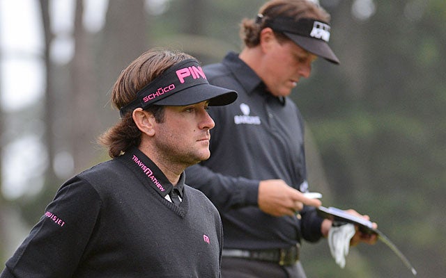 Bubba Watson and Phil Mickelson, two-thirds of the day's most celebrated group, shoot 14 over. (Getty Images)
