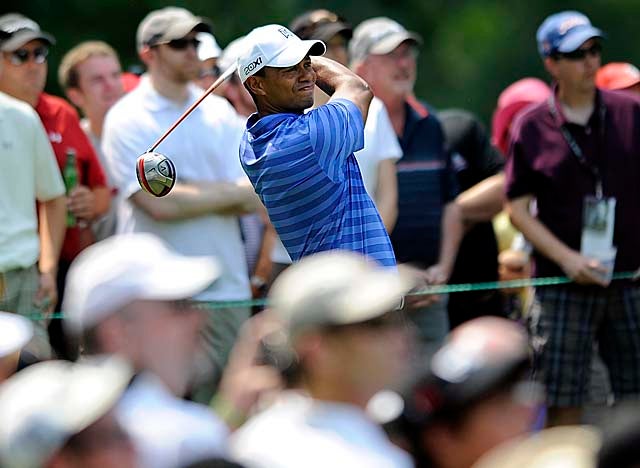 With the help of a 50-foot eagle on No. 16, Woods gets back into the mix Friday. (AP)