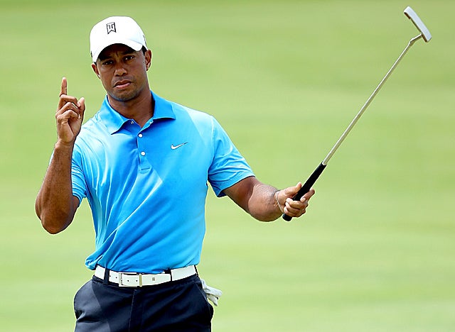 Woods sinks the second of two birdies early in the second round at windy Kiawah Island. (Getty Images)