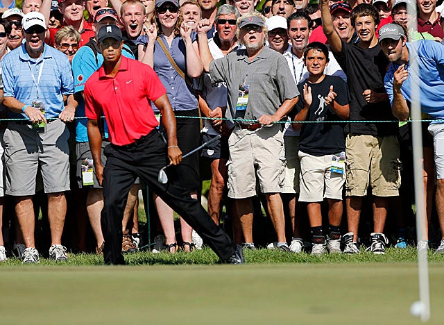 Woods doesn't make this chip in on the fifth hole at TPC Boston, but finishes in third place. (AP)