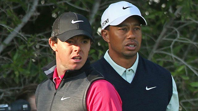 Rory McIlroy and Tiger Woods spend most of the round making faces at their wayward shots. (Getty Images)