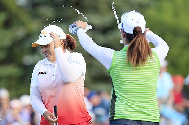 Back-to-back majors winner Inbee Park gets a celebratory dousing from fellow Korean golfer Chella Choi. (USATSI)