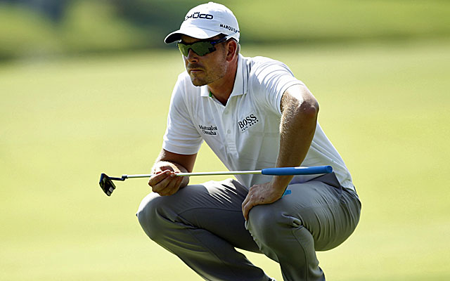 Henrik Stenson's last birdie from 4 feet on the 18th gives him a 6-under 64 and a one-shot lead over Adam Scott. (USATSI)