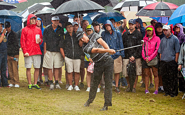 Henrik Stenson, who leads by four strokes, hits from the rough on the 17th hole on Saturday. (USATSI)