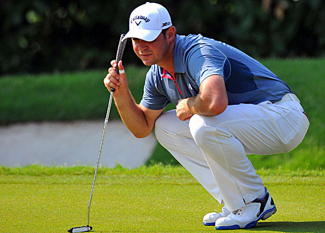 Gary Woodland lines up a putt during the CIMB Classic in Malaysia. (Getty Images)