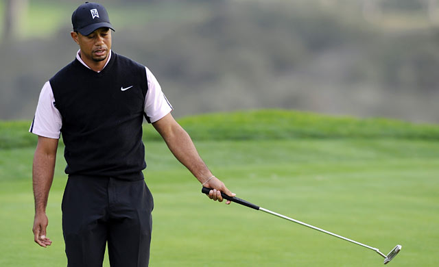 Tiger reacts to missing a birdie putt on the 16th. (USATSI)