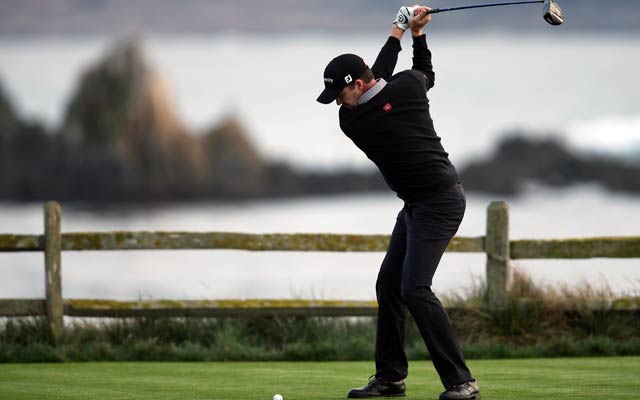 Jimmy Walker braves the elements with a bogey-free round at Spyglass Hill. (Getty Images)