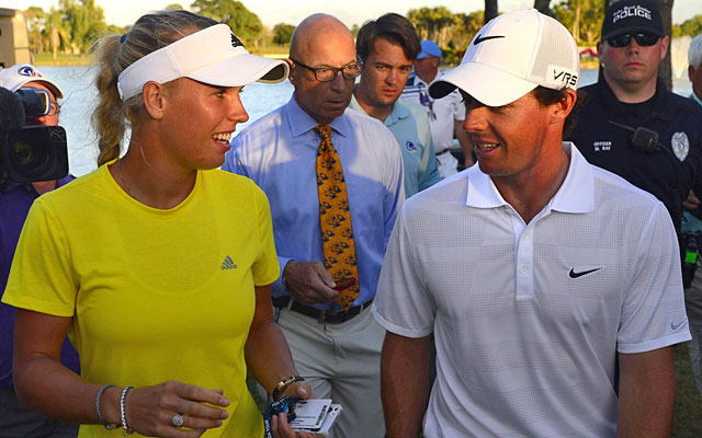 Rory McIlroy heads to the clubhouse with girlfriend Caroline Wozniacki after his third round. (USATSI)