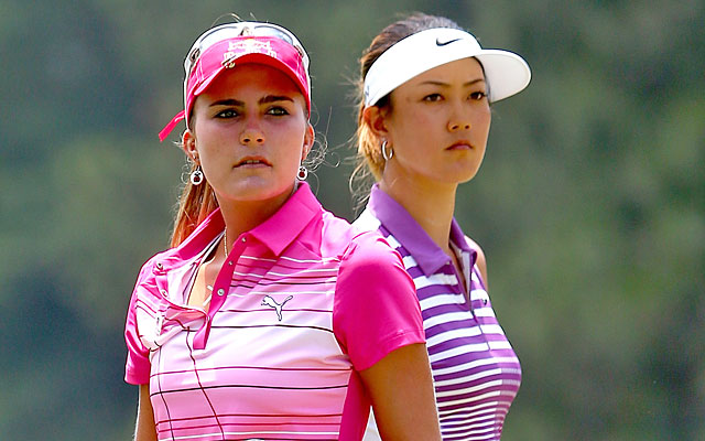 While playing partner Lexi Thompson fades with a 74, Michelle Wie stays atop the leaderboard. (Getty Images)
