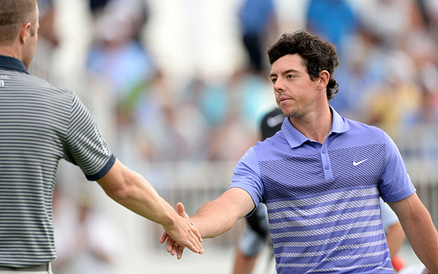 Rory McIlroy shakes hands with FedEx Cup leader Chris Kirk after their round. (USATSI)