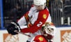 Ballard whacks his Panthers teammate Monday night. 