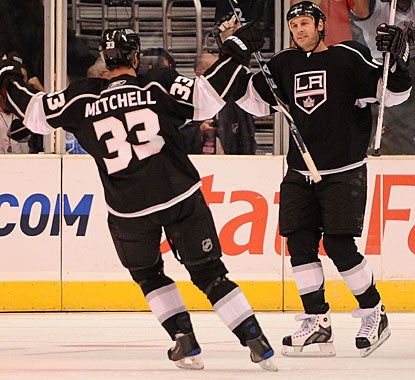 Ryan Smyth (right) scores the first goal for L.A., sets up the second and puts the game away with an empty netter. (Getty Images)