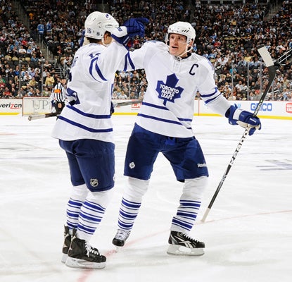 The Leafs' Clarke MacArthur (left) celebrates after scoring the first of his two goals against the Penguins.  (Getty Images)
