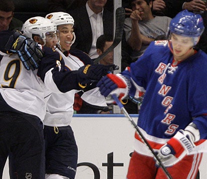 Evander Kane (9) enjoys his sixth goal of the season with teammate Anthony Stewart, who assists on the play. (AP)