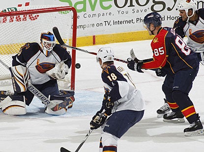 Chris Mason makes 22 saves in the second period after he is bombarded with shots from everywhere. (Getty Images)