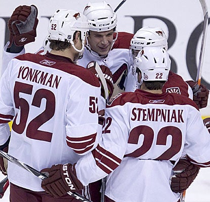 Phoenix's Taylor Pyatt (center) celebrates his game-winning goal with teammates Nolan Yonkman and Lee Stempniak. (AP)