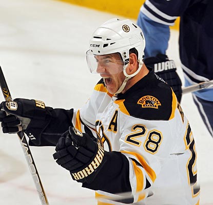 Mark Recchi celebrates after he knocks the puck in from the doorstep to become the 13th player to 1,500 points. (Getty Images)