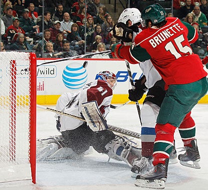 Andrew Brunette crashes the net, but Craig Anderson is able to make the save, one of 32 on the night. (Getty Images)