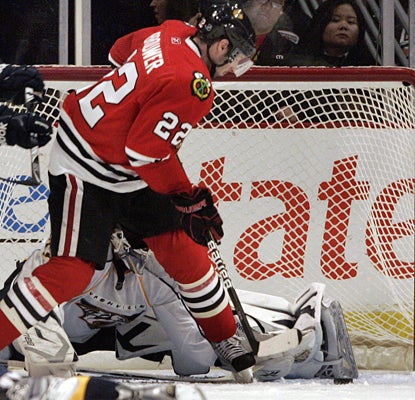 Troy Brouwer scores one of his two goals against the Predators during the Blackhawks' win. (AP)