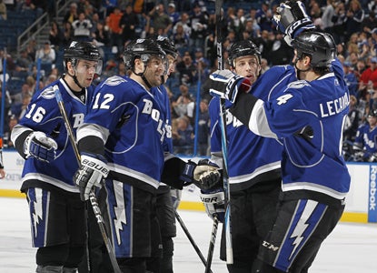 Simon Gagne (12) of the Lightning celebrates his second-period goal against the Thrashers with teammates. (Getty Images)