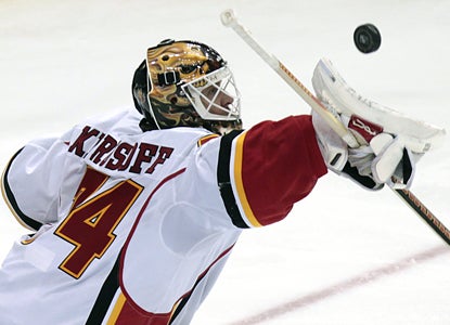 Flames goalie Miikka Kiprusoff blocks a shot as he makes 22 saves for the win. (AP)
