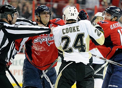 Alex Ovechkin and Nicklas Backstrom go after Matt Cooke, who took a knee-to-knee hit on Ovechkin. (Getty Images)