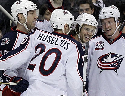 Blue Jackets players have reason to be happier after losing 7-2 to Pittsburgh the last time they met in early December. (AP)